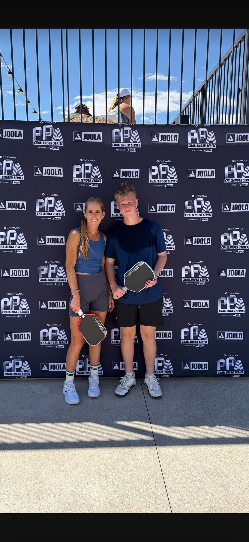 Coach Liz Boydston with a junior pickleball player at a PPA event